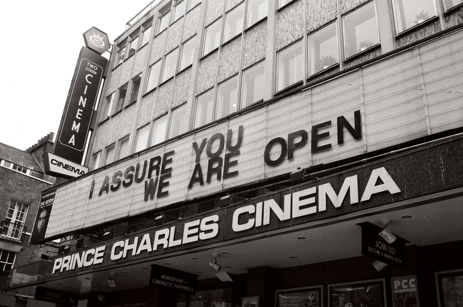 a black and white photo of a movie theater